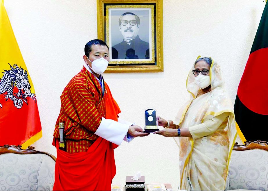 Prime Miniter Sheikh Hasina presenting a coin as memento to visiting Bhutanese Prime Miniter Dr Lotay Tshering marking Mujib Borsho at Prime Miniter’s Office on Wednesday.