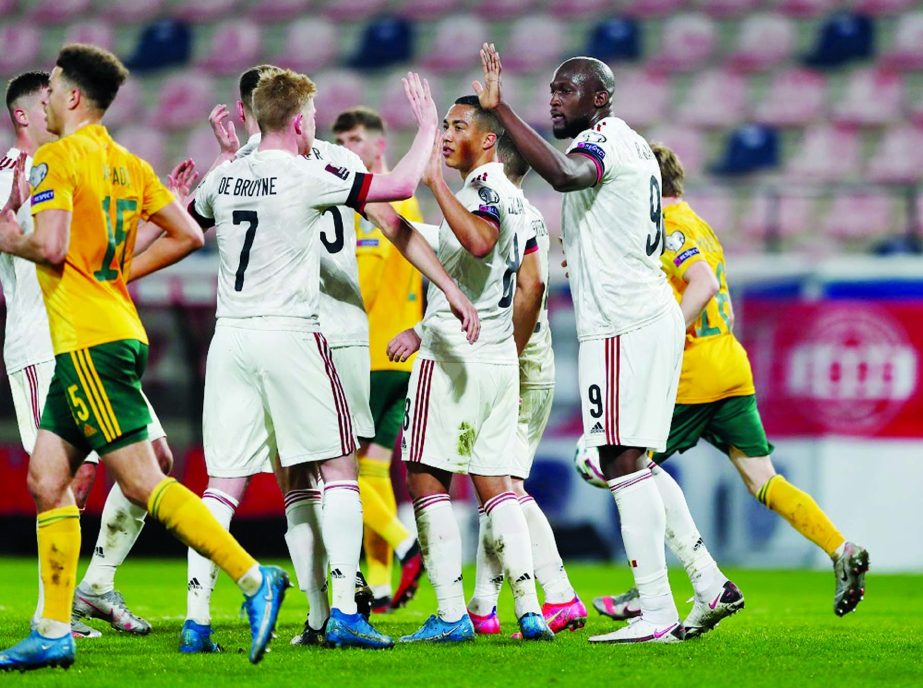 Belgium's Romelu Lukaku (right) celebrates with teammates after scoring their third goal against Wales on Wednesday.