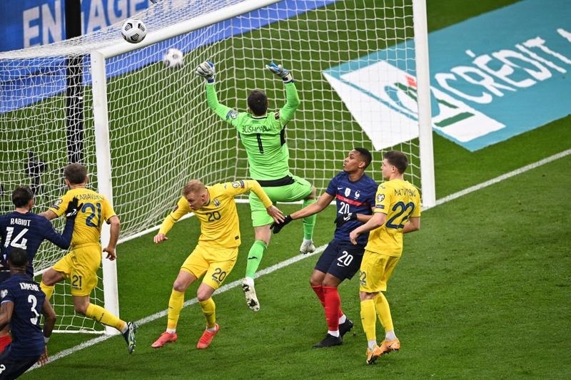 Ukraine's goalkeeper Georgi Bushchan (center) makes a save during the FIFA World Cup Qatar 2022 qualification football match against at the Stade de France in Saint-Denis, outside Paris on Wednesday.