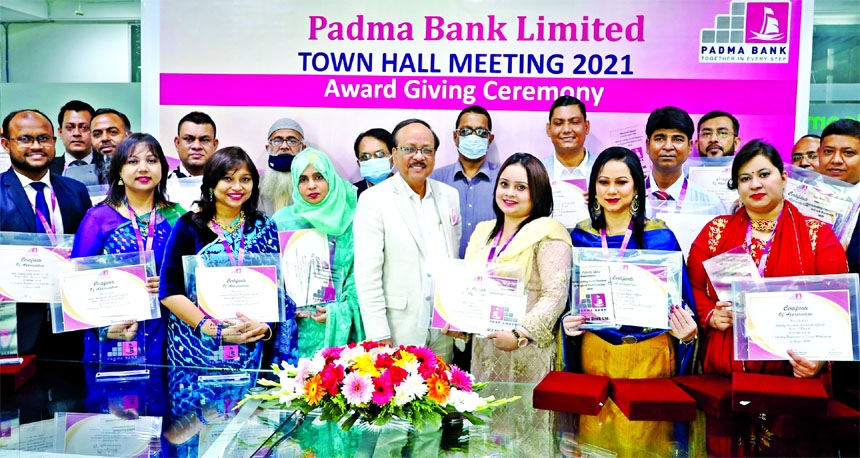 Md. Ehsan Khasru, Managing Director and CEO of Padma Bank Limited, pose with the winners of 'Best Performer Award-2020' at the bank's head office in the capital on Thursday. The bank awarded 20 best performing employees for their contribution to the ba