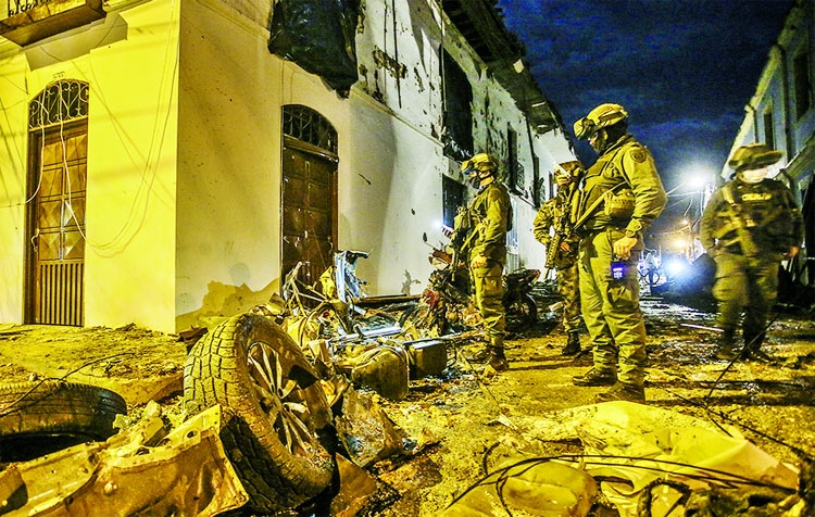 Police inspect damages caused by a blast in front of Corinto Mayor's Office, Cauca department in Colombia.