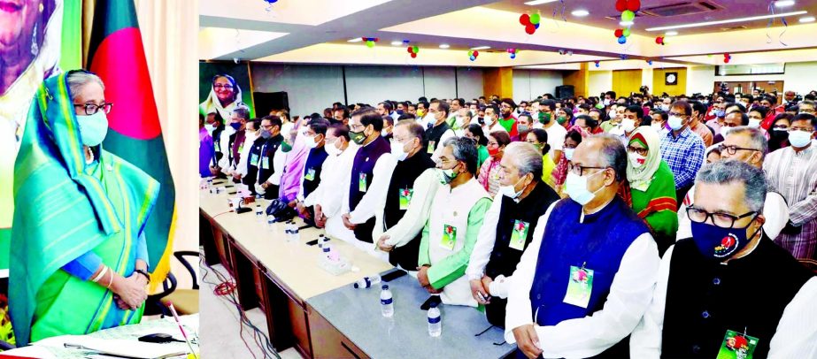 Prime Minister Sheikh Hasina participates the discussion programme virtually from Ganobhaban on Sunday. All the AL leaders stood in solemn silence for one minute to show respect to the memories of the martyrs of Liberation War at the discussion programme