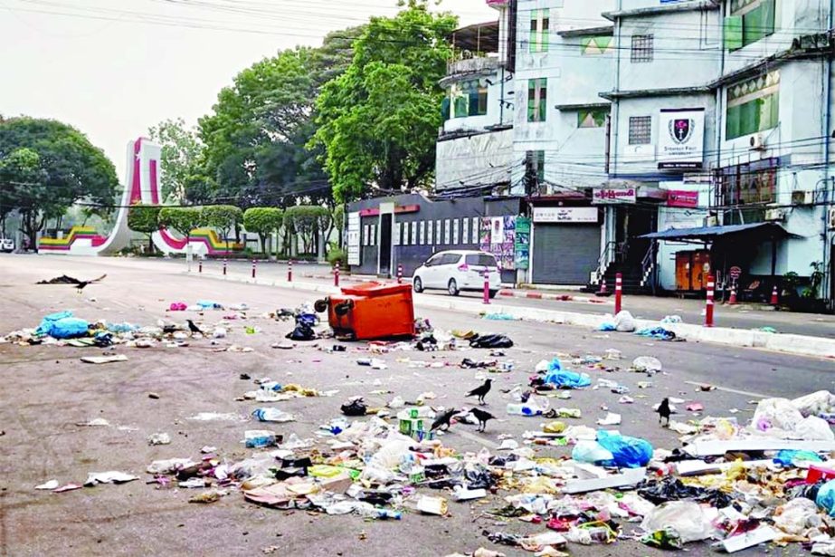 Protesters throw garbage on the road to protest against the military coup in Yangon, Myanmar on Tuesday.