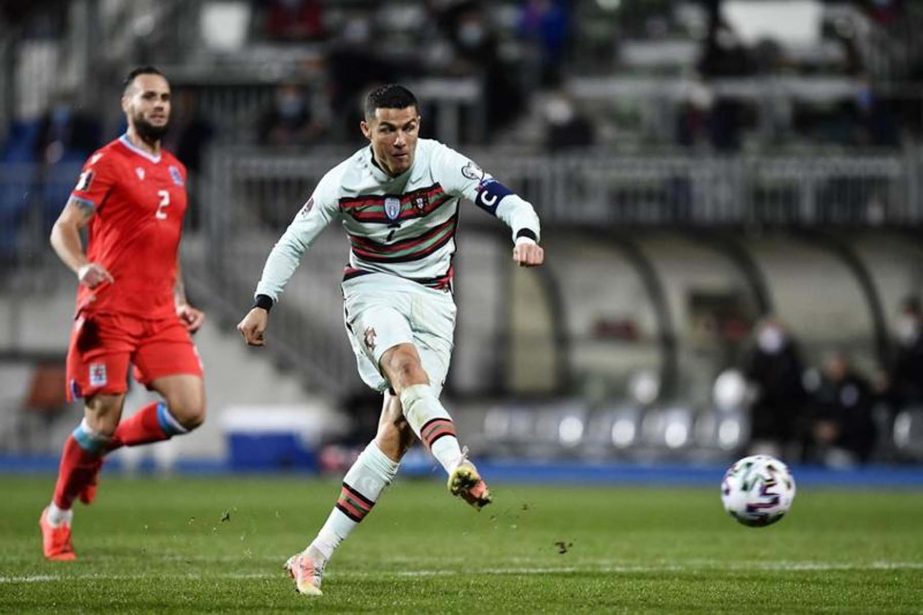 Portugal's forward Cristiano Ronaldo shoots the ball during the FIFA World Cup Qatar 2022 qualification Group A football match between Luxembourg and Portugal at the Josy Barthel Stadium in Luxembourg City on Tuesday.