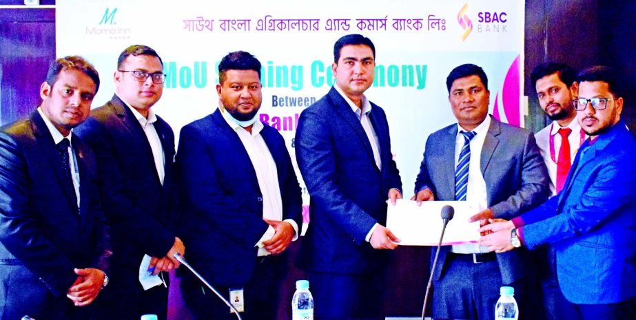 Mohammad Shafiul Azam, Head of Card Division of South Bangla Agriculture and Commerce (SBAC) Bank Limited and Gazi K. Rahman, GM of Momo Inn Hotel & Resort, Bogura, exchanging document after signing an agreement at the resort recently. Under the deal, deb