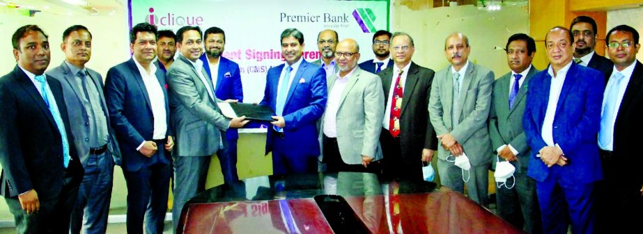 Golam Awlia, AMD of Premier Bank Limited and Mohammad Salahuddin, Managing Director of I-Clique Solutions Limited, exchanging document after signing an agreement at the bank's head office in the capital recently for purchasing comprehensive Visa, MasterC