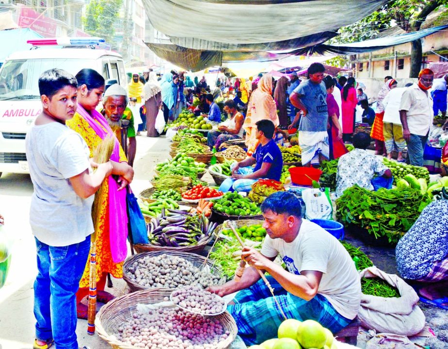 People throng at kitchen market without following any health guidelines amid surge of Covid-19 infection in the recent days. This photo was taken from city’s Manda Kitchen market on Wednesday.
