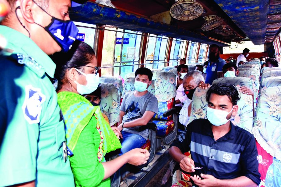 Mobile Court of BRTA conducts a drive in the city's Ramna area on Saturday to verify health guidelines by the passengers.