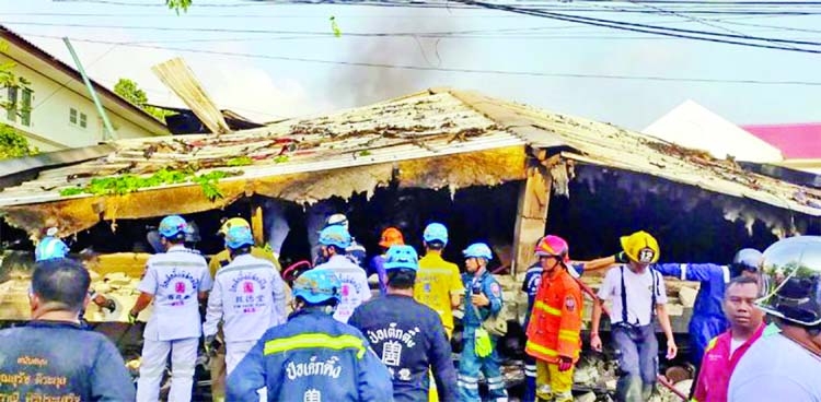 Rescue workers at the site of a building collapse in Bangkok, Thailand on Saturday.