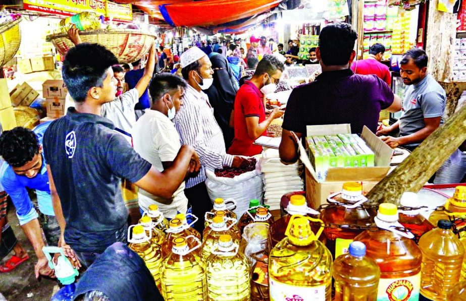 Shoppers throng Karwan Bazar in the capital Saturday afternoon following the news of lockdown.