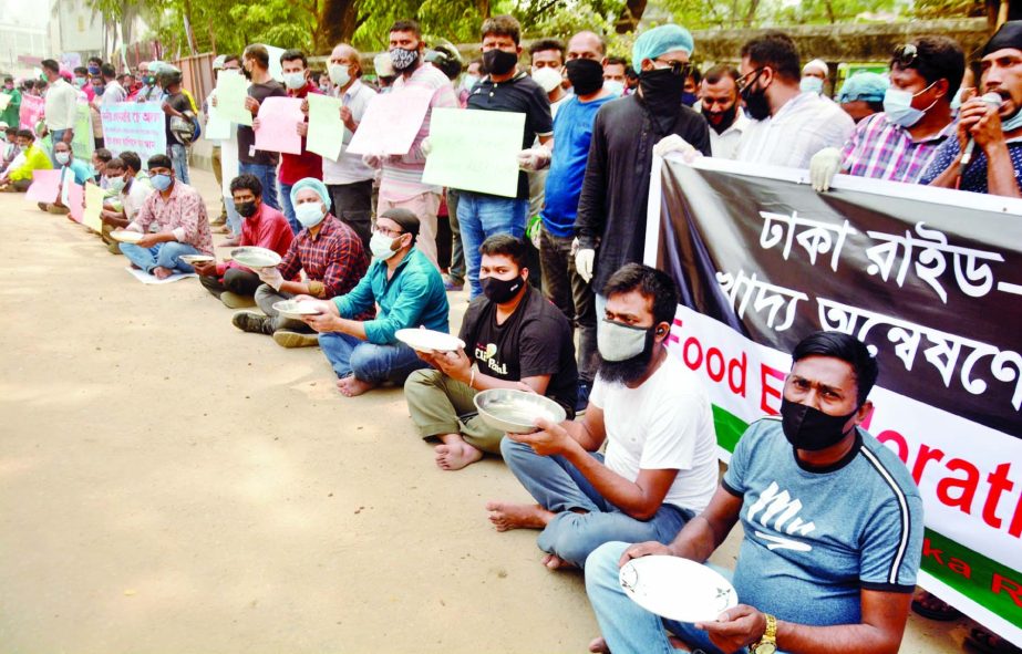 Bikers stage a sit-in programme with empty plates in front of the Jatiya Press Club in the capital on Sunday demanding to run apps-based bikes.
