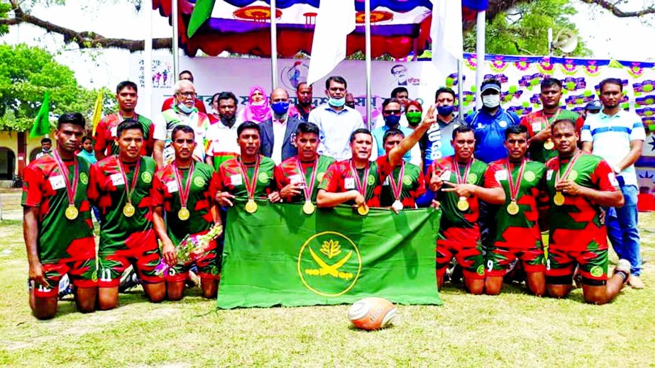 Members of Bangladesh Army, the gold medal winners in the men's division of the rugby competition of the Bangabandhu 9th Bangladesh Games with the guests and officials pose for a photo session at Rangpur Zilla School Ground on Sunday.
