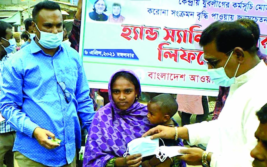 Shaghata Upazilla Chairman Jahangir Kabir distributes masks, soaps and leaflet among the people during the awareness campaign against coronavirus in the upazilla on Tuesday.