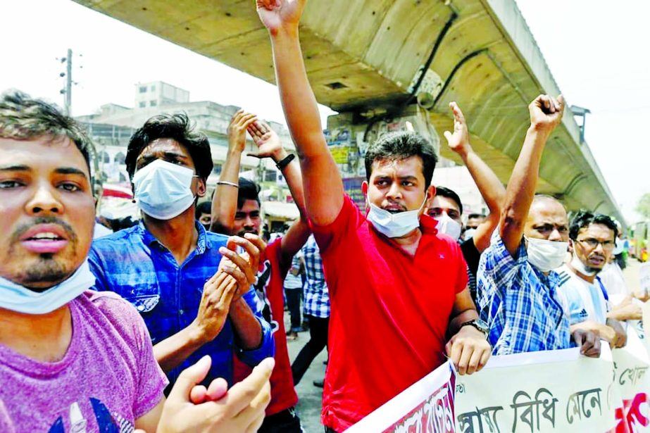 Shop owners and employees demonstrate at Bangobazar, Fulbaria and other parts of the city with call to the government on Wednesday to withdraw ban imposed on Monday due to tackle Corona pendemic.