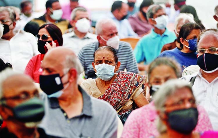 People wait to receive a dose of COVISHIELD, a Covid-19 vaccine manufactured by Serum Institute of India, in Mumbai.