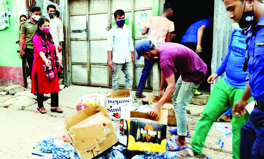A BSTI mobile court led by Executive Magistrate Bhairab UNO Lubna Farzana dumps ice-cream making ingredients seized from a fake ice -factory at Bhairab town on Thursday night. Factory owner Ibrahim Miah was fined Tk.4 lakh for making and marketing ice-cre