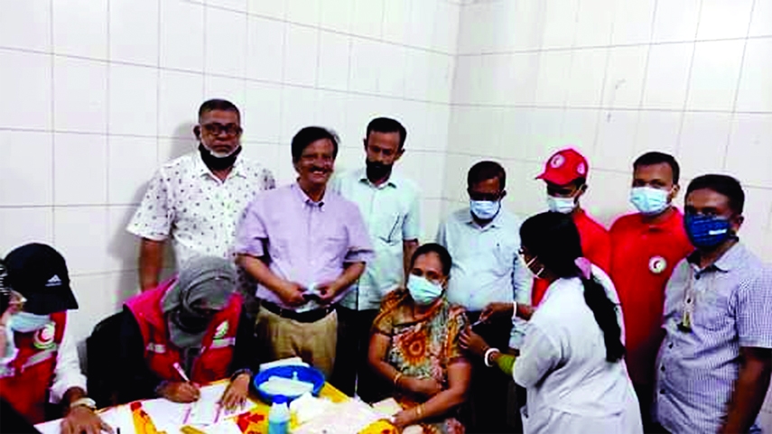 Feni District Parishad Chairman and President of the District Red Crescent Society Khairul Bashar Majumder Tapon inaugurates the Covid 2nd dose vaccine inoculation programme at the Sadar Hospital of Feni on Saturday.