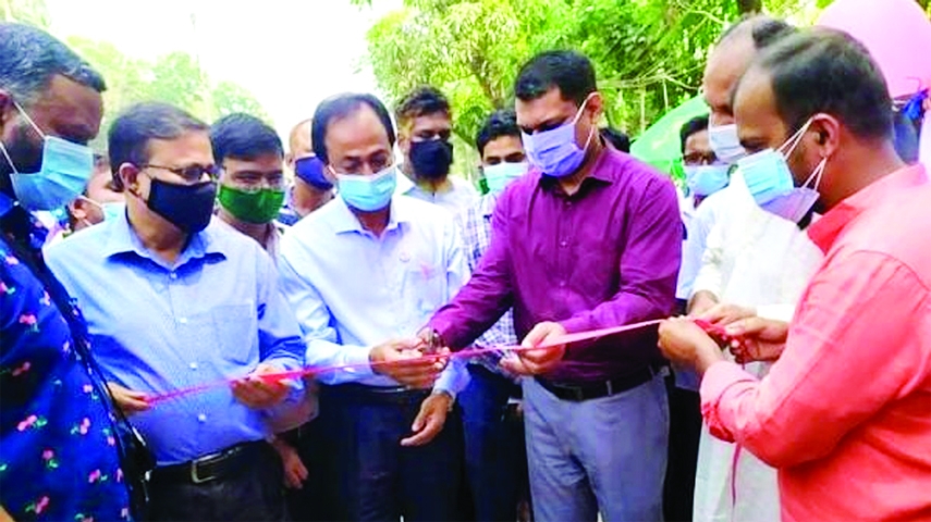 Rangpur Deputy Commissioner Asib Ahsan inaugurates a program of mobile sale of milk, eggs and meat at fair price in front of the Rangpur main post office adjacent to Kachari Bazar in the city on Sunday.