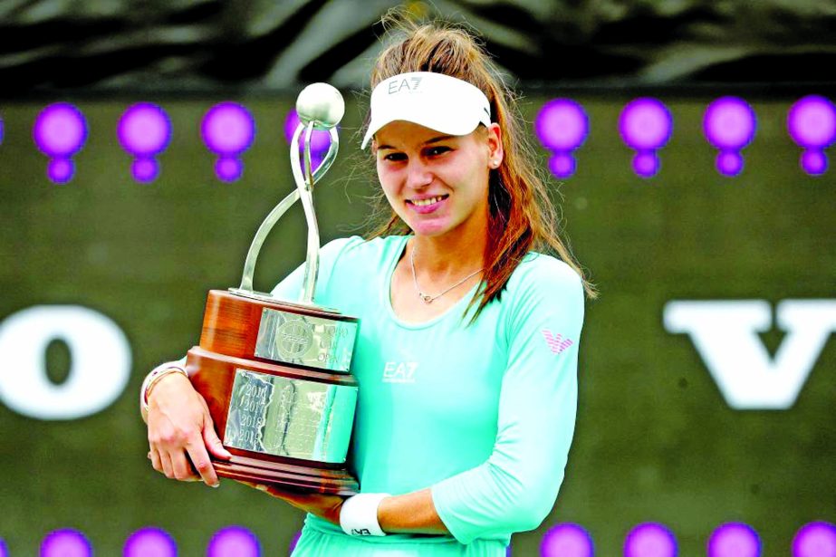 Veronika Kudermetova of Russia poses with the winner's trophy after defeating Danka Kovinic of Montenegro in the final of the Volvo Car Open at LTP Daniel Island Tennis Centre on Sunday.