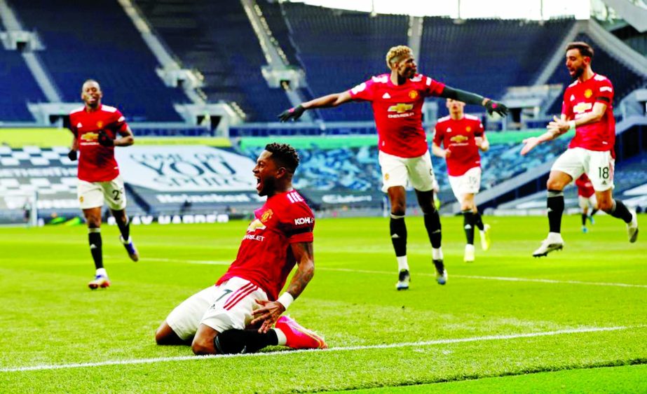 Manchester United's Fred (front) celebrates scoring their first goal against Tottenham Hotspur with Aaron Wan-Bissaka in London on Sunday.
