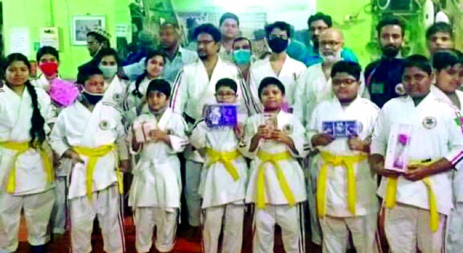 The participants of Karate belt grading test of Bangladesh Koshiki Organisation and the officials of the Organisation pose for a photo session in the city's Gendaria recently.