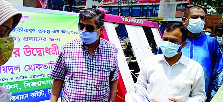 Ubaidul Muktadir Chowdhury, MP distributes agricultural machinery, seeds and fertilizers among marginal farmers in Bijoynagar, Brahmanbaria on Monday.