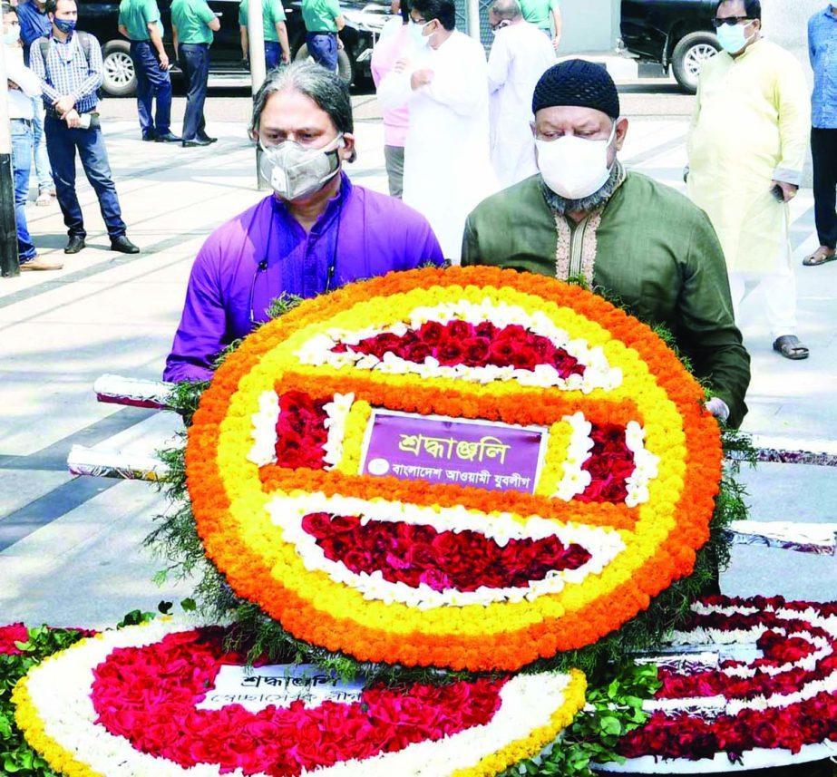 Central leaders of Bangladesh Awami Juba League place floral wreaths at the portrait of Bangabandhu in the city's 32, Dhanmondi on Saturday marking histiric Mujibnagar Day.