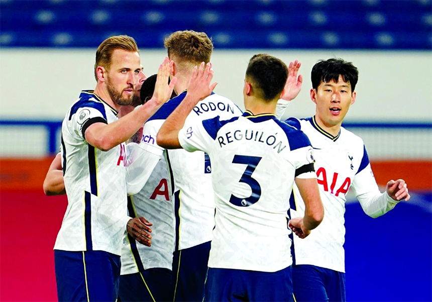 Tottenham Hotspur's Harry Kane (left) celebrates with teammates after scoring the first goal against Everton on Friday.