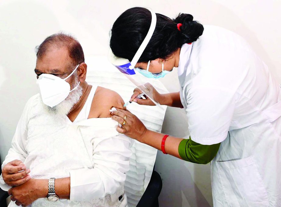 Liberation War Affairs Minister AKM Mozammel Haque receives the second dose of Covid-19 vaccine at Bangladesh Secretariat Clinic on Monday.