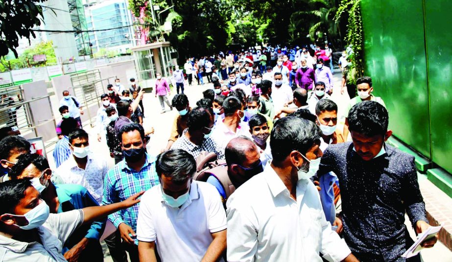 Saudi expatriates crowd the Saudi Airlines for ticket confirmation and collection. The snap was taken from Sonargaon Hotel in the city on Monday.
