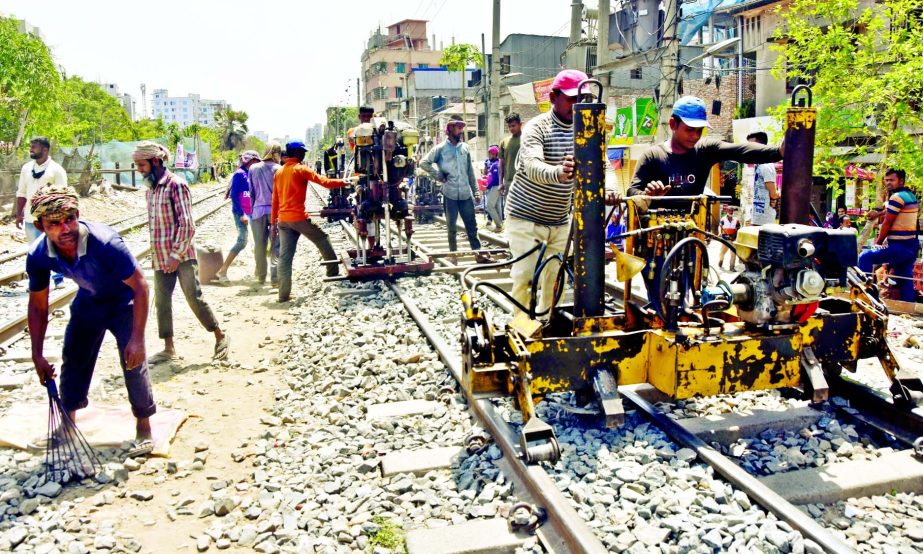 Railway men maintaining the rail line at Malibagh area in the capital on Tuesday as train movement remained halted due to lockdown.