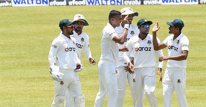 Taijul Islam (right) of Bangladesh, celebrates with Taskin Ahmed (centre) after dismissal of Angelo Mathews (not in the picture) of Sri Lanka during the third day play of the first Test between Bangladesh and Sri Lanka at Pallekele International Cricket S