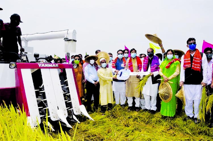 Agriculture Minister Dr. Abdur Razzaque distributes 'Combine Harvester and Reaper' among farmers of Baniachang Upazila in Habiganj on Friday.