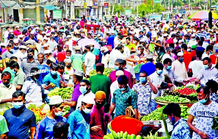 People throng an open market in the capital’s Nayapaltan area on Friday.