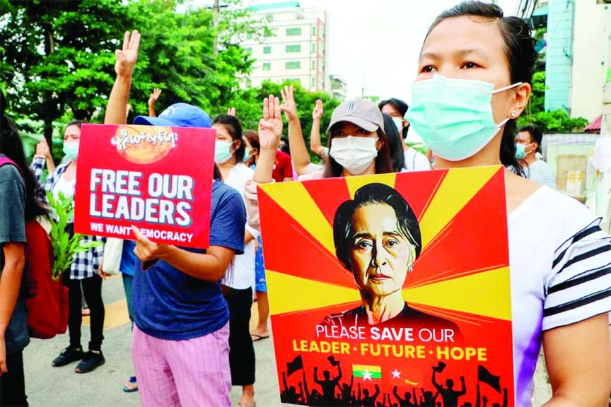 Anti-coup protesters held a banner which read 'ASEAN respect our vote' as they marched on a street in Yangon, Myanmar.