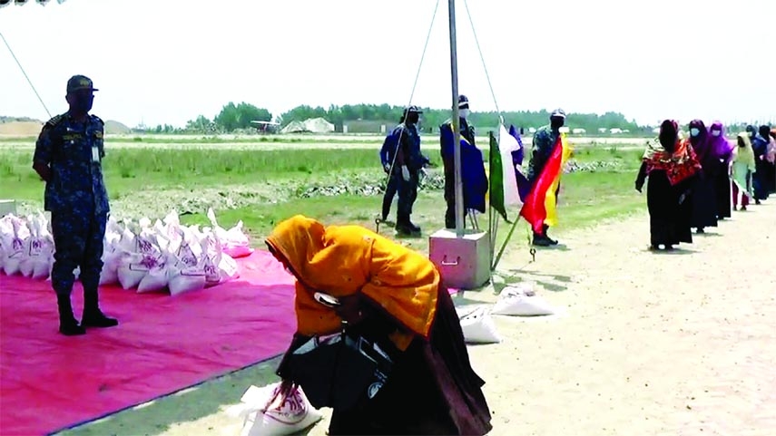 Sher-E-Bangla naval base of Bangladesh Naval Force distributes food relief among distressed people at Lalua under coastal Kalapara upazila of Patuakhali recently.