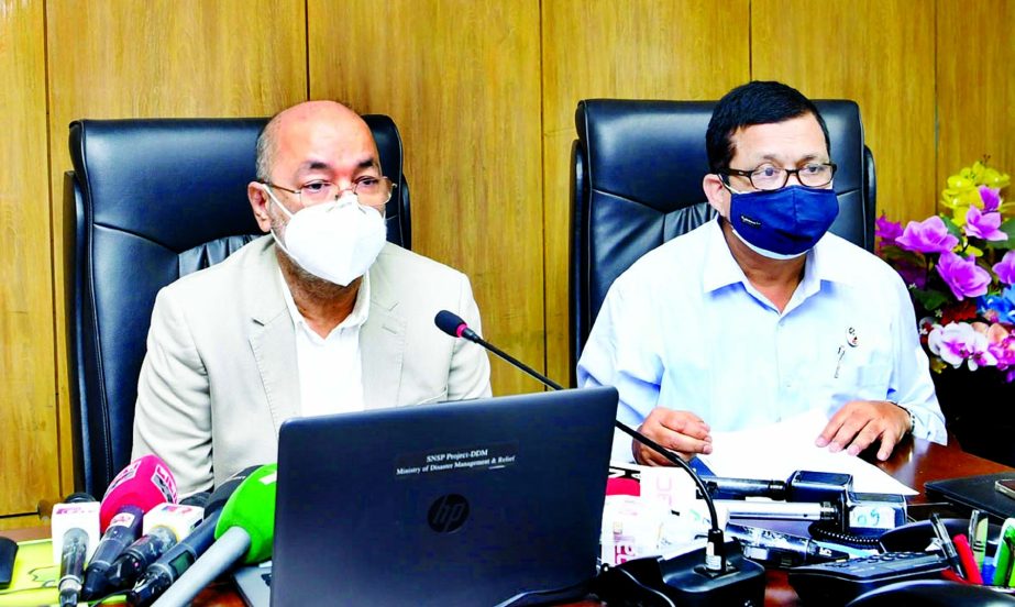 State Minister for Disaster Management and Relief Dr Md Enamur Rahman briefs to the journalists about overall relief programme to tackle Covid-19 at the Ministry office on Sunday.