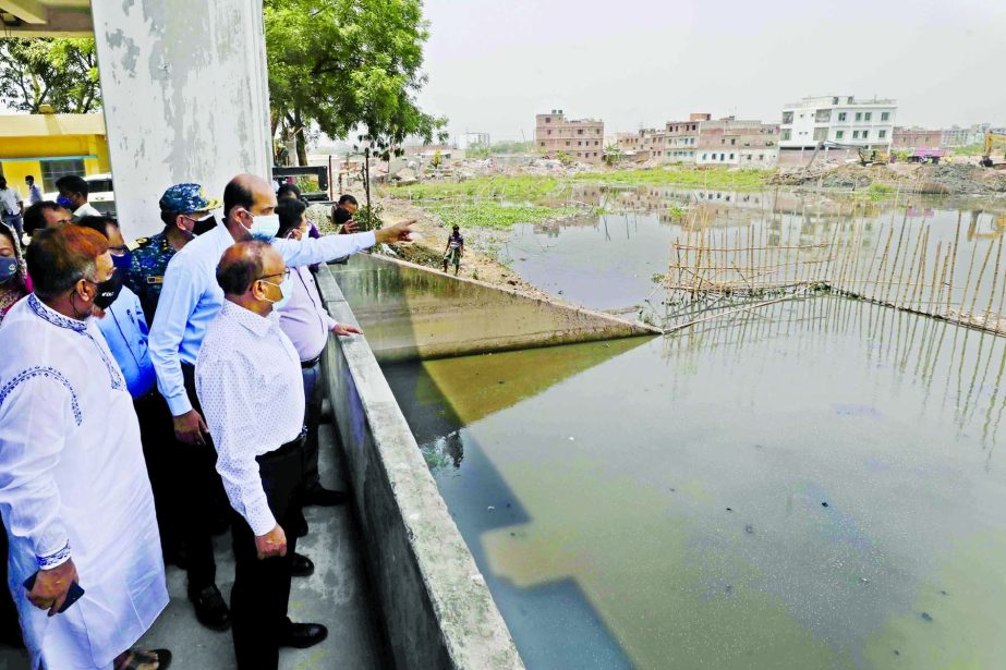 LGRD and Cooperatives Minister Tajul Islam inspects acquisition land for the retention pond of Kalyanpur Pupm in the city on Tuesday. DNCC Mayor Atiqul Islam was present on the occasion.
