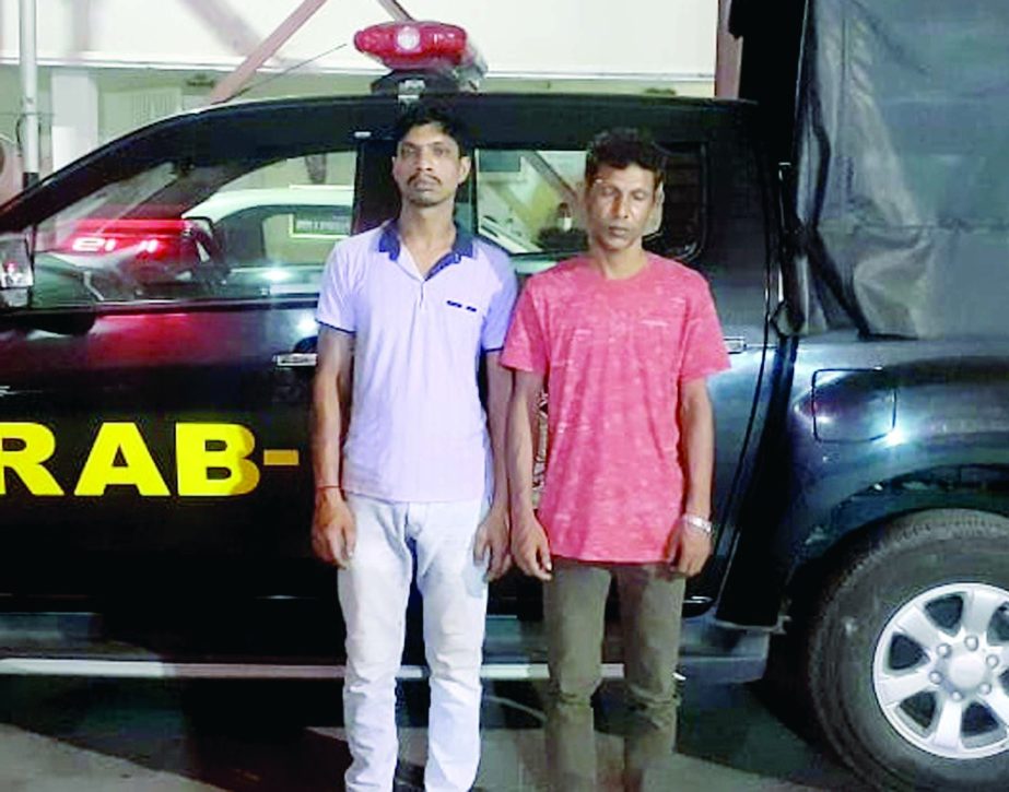 A team of.RAB detains 2 drug traders with a private car conducting raid in the city's Jatrabari area on Tuesday.