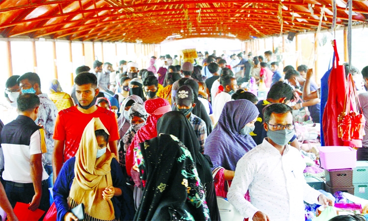 Hundreds of Eid shoppers at the New Market foot over bridge on Wednesday as the frestival draws closer.