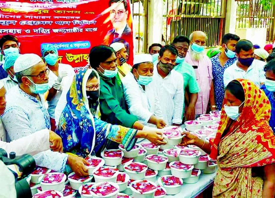 Food items were distributed among the poor people at Golap Shah Mazar area of the capital city on Thursday. Ahmed Ullah Madhu, Dhaka South City Jubo League Senior Vice-President organized the event. Dhaka South City Awami League member Syeda Roksana Islam