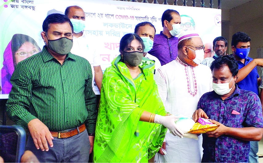 Farzana Sharmin Beauty, Panel Chairman of Mymensing Zilla Parishad, on Wednesday distributes Eid items among 1500 poor, destitute families of four Unions under Fulbaria upazila of the district to survive the corona pandemic.