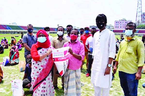 Deputy Commissioner of Chandpur Anjana Khan Majlish hands over relief goods to 500 poor families of the districts in a formal ceremony held at Chandpur District Stadium on Wednesday.