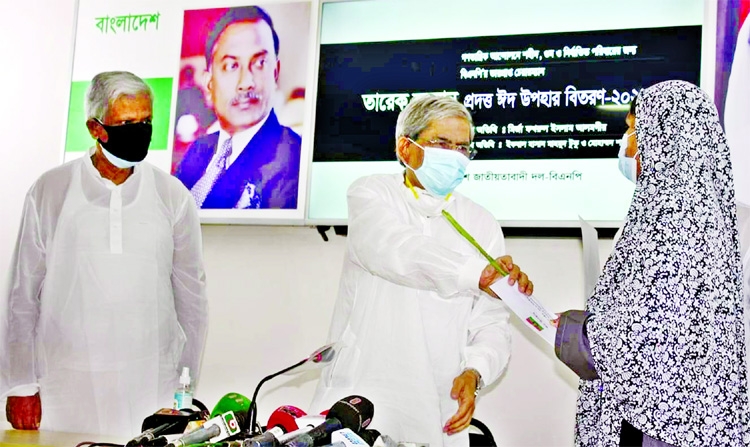 On behalf of Acting Chairman of BNP Tarique Rahman, Secretary General of the party Mirza Fakhrul Islam Alamgir distributes Eid gifts among the families of disappeared party men at the party's Gulshan office in the city on Friday.