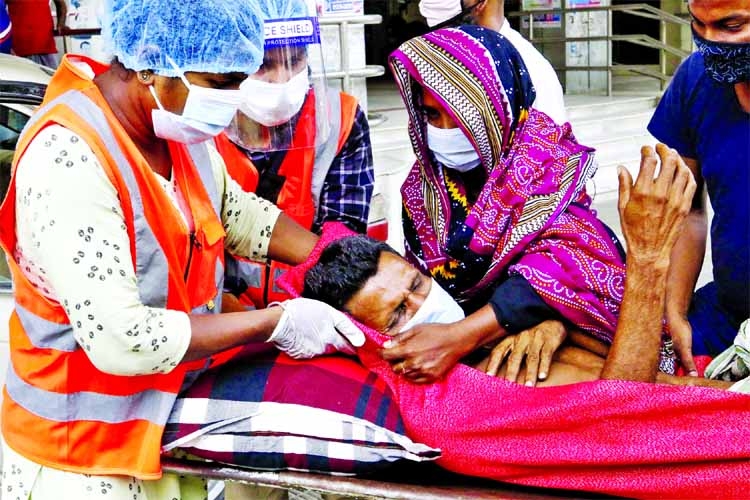 A Covid-19 patient with low oxygen saturation level being taken to the emergency unit of the Dhaka Medical College Hospital on Friday.