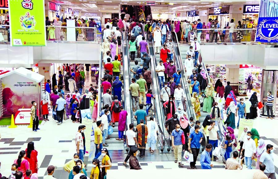 Bashundhara City Shopping Mall in the capital witnesses a huge crowd of shoppers on Thursday ahead of the Eid-ul-Fitr festival.