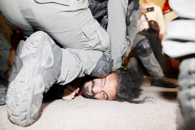 Israeli security forces detain a Palestinian man protesting evictions in the Sheikh Jarrah neighbourhood of East Jerusalem.