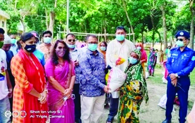 Rejowan Ahamed Tofique, MP distributes PM's food items among 400 poor families at Itna Upazila Parishad premises on Wednesday afternoon. Upazila Chairman Principal Kamrul Islam presided over the programme.