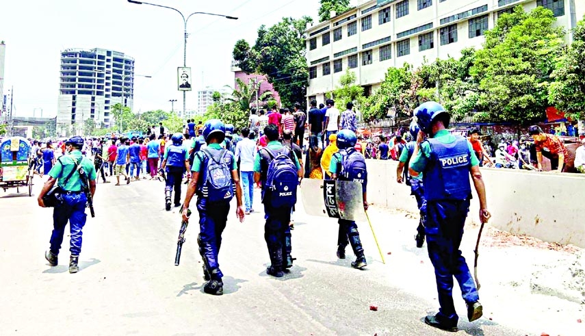 Police disperse garment workers who demonstrated in the city’s Mirpur area on Saturday demanding their arrears and resumption of long-distance bus service.