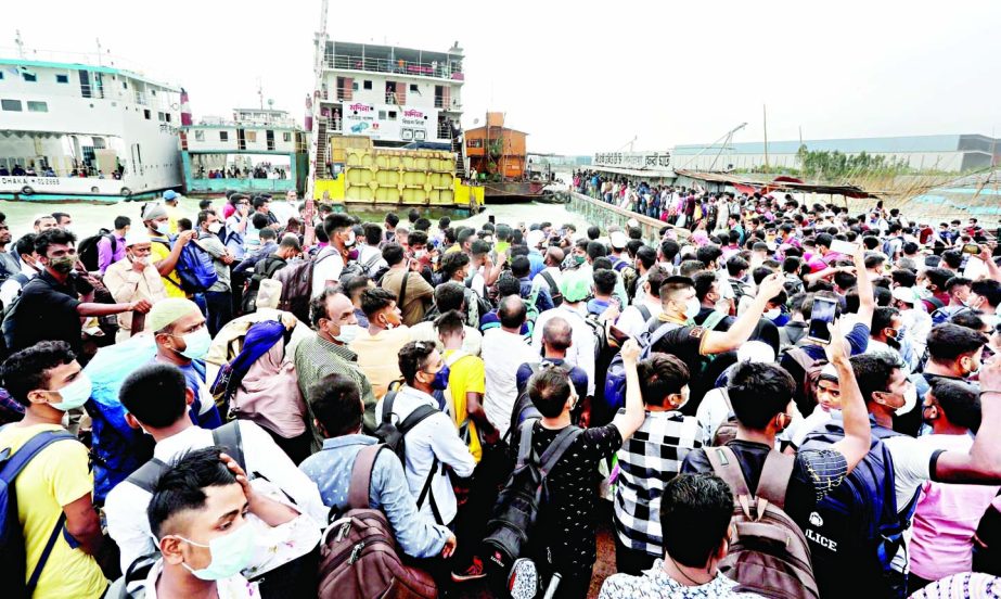 Eid home-goers flock recklessly to Munshiganj’s Shimulia ferry terminal on Sunday.